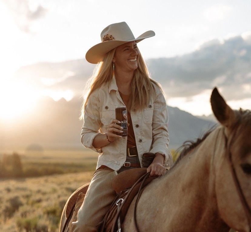 A woman on a horse wearing a KUHL Kultivatr Jacket